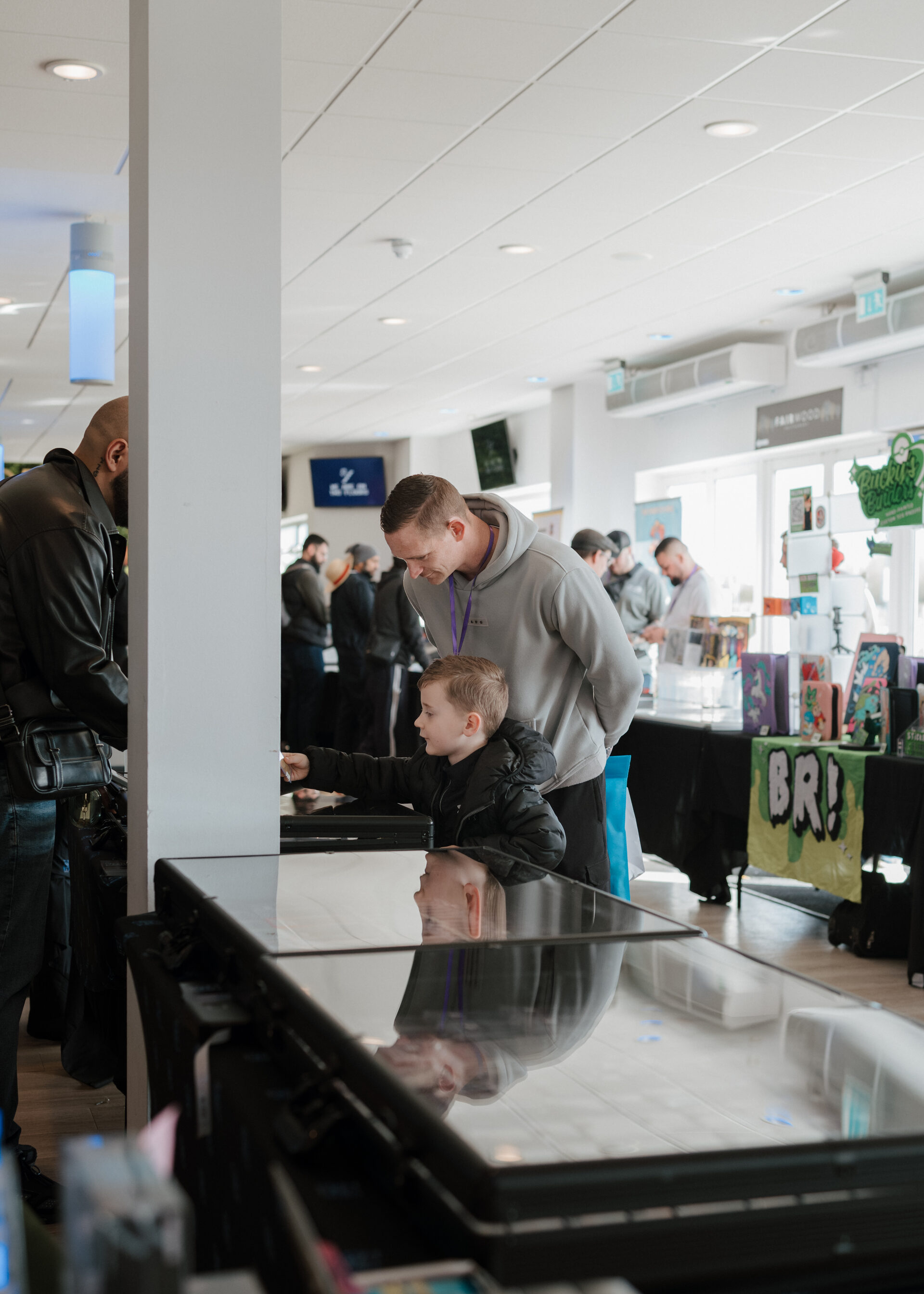 Father and child browsing cards